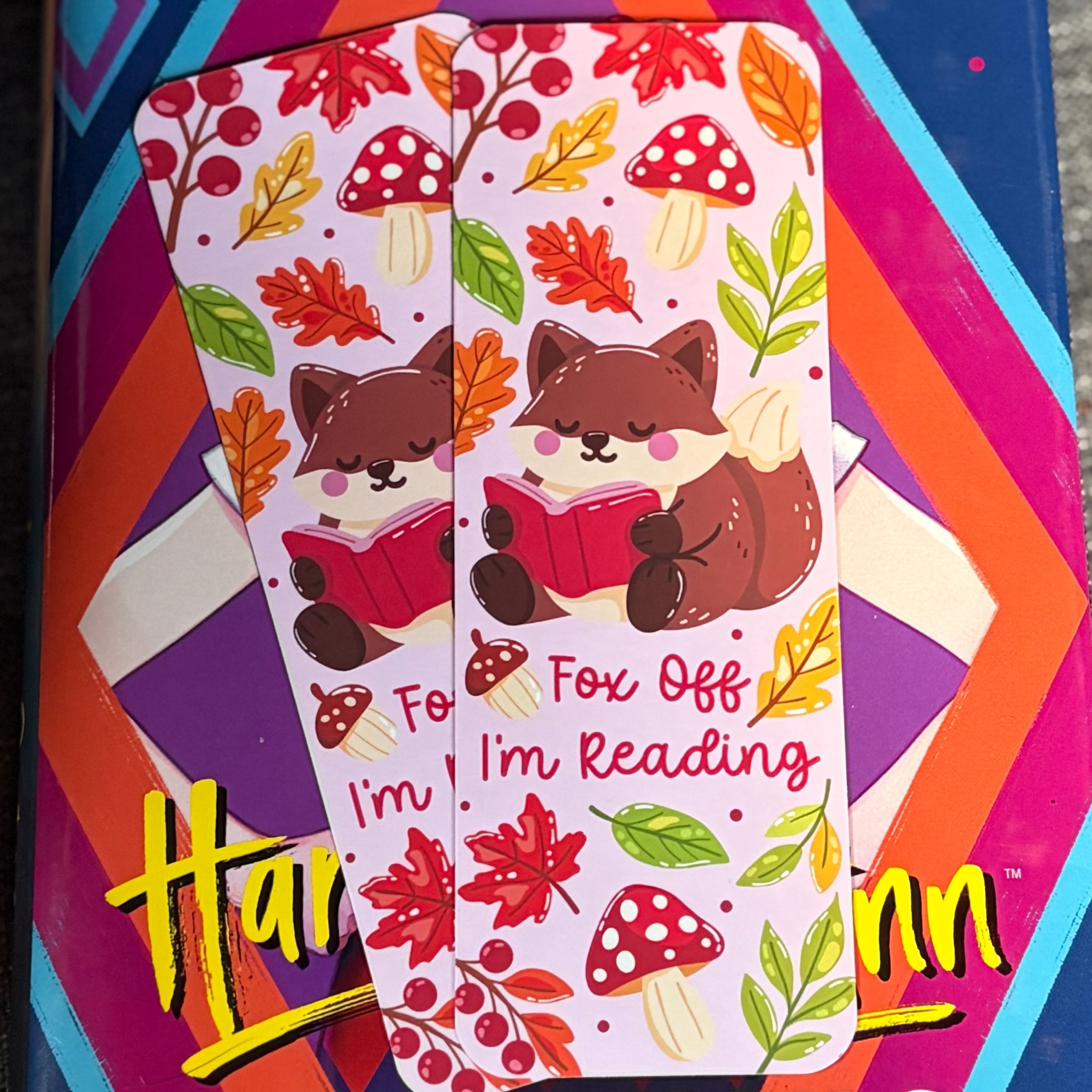 Autumn Fox Off I’m Reading bookmark featuring a fox with a red book, colourful leaves, berries and mushrooms
