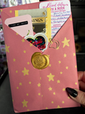 mystery blind date with a book, sticker, treat, gold wax seal with bookmark and sticker