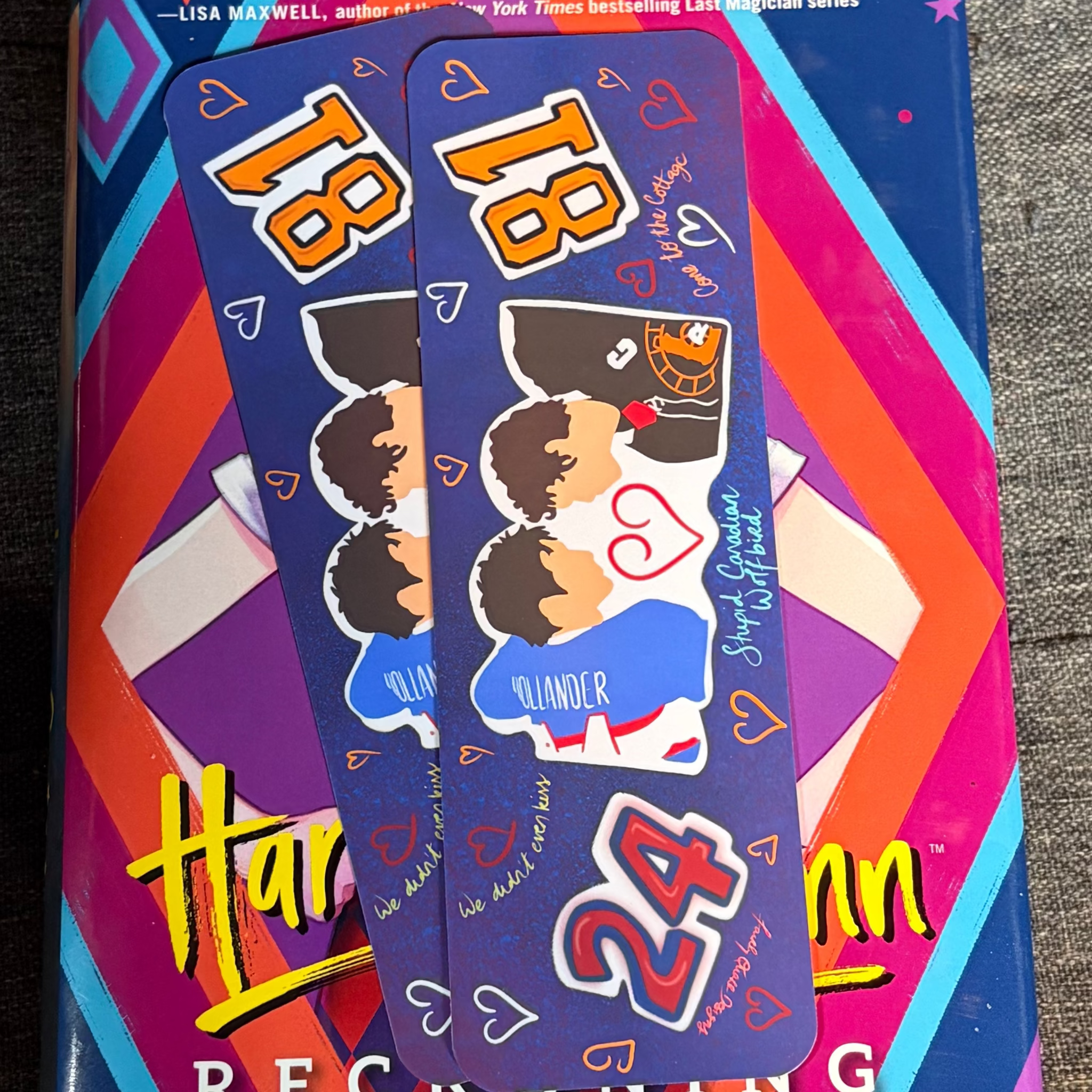 Blue Heated Rivalry inspired bookmark with cartoon versions of Shane and Ilya, hockey shirts, hearts and numbers 18 and 24
