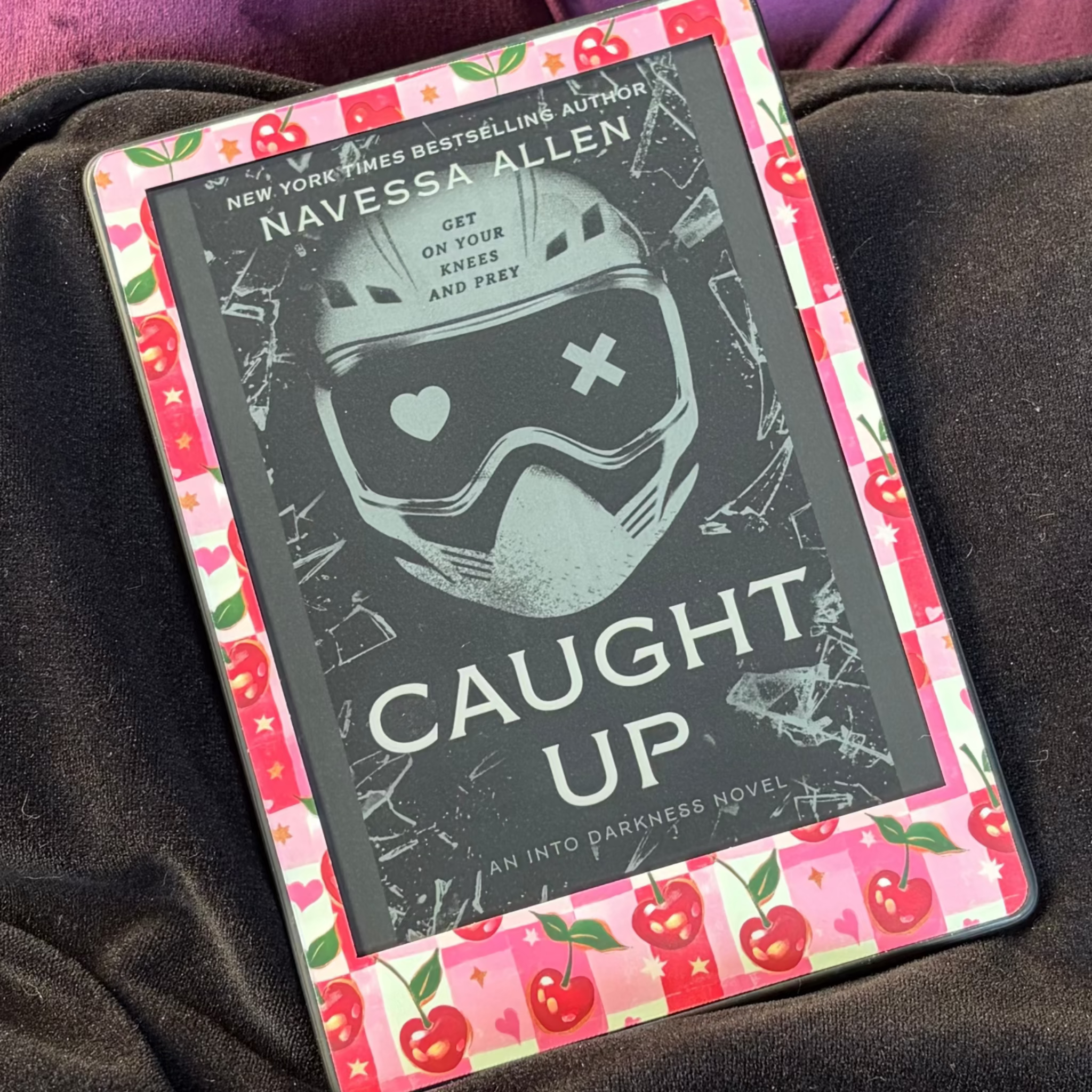 Cherry Gingham removable front Kindle skin with red cherries, green leaves, hearts and gold stars on a pink-and-white checked background
