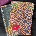 Classic brown leopard-print Kindle backing insert with red lips and a dense multicoloured glitter finish
