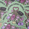 Green Emotional Support Trinkets sticker featuring pink and purple keychains, charms, crystals and little everyday essentials

