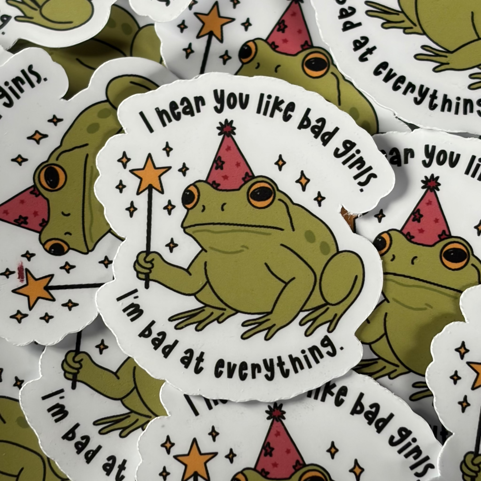 I hear you like Bad Girls, I'm bad at everything , Frog, Single Sticker. Cute, funny, relatable, mental health, toad, wizard, magical wand, stars, pink and green