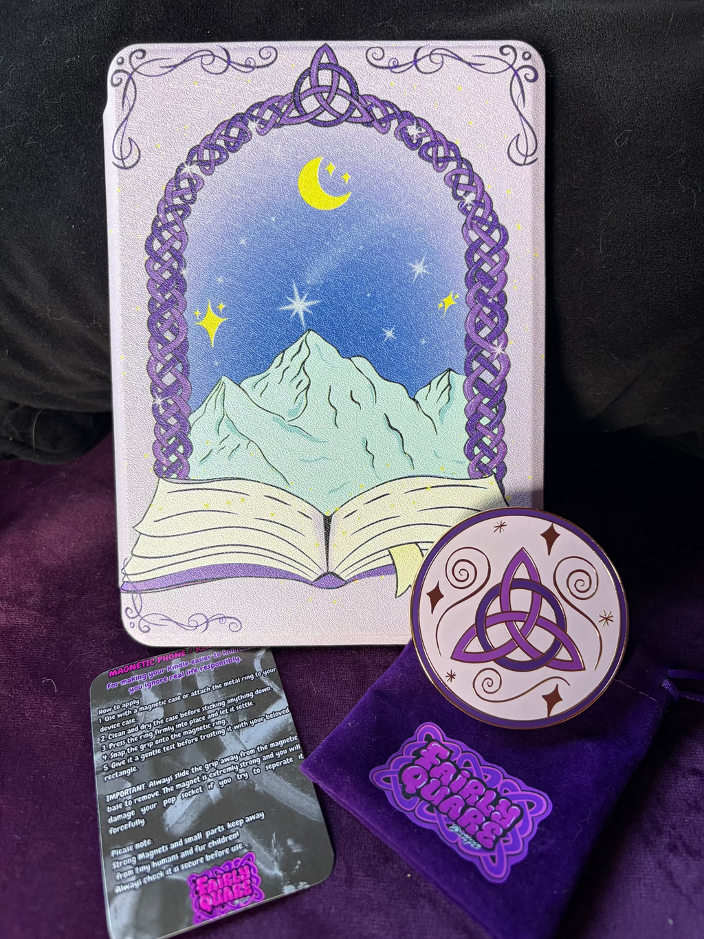 Kindle Hard Flip Case - Celtic Dreamer. Purple Case with dreamy Snow capped mountains and a celestial backdrop. A magical Celtic doorway appears from an open book  3 in 1 Flip case for Kindle. Features auto wake/sleep function, detachable