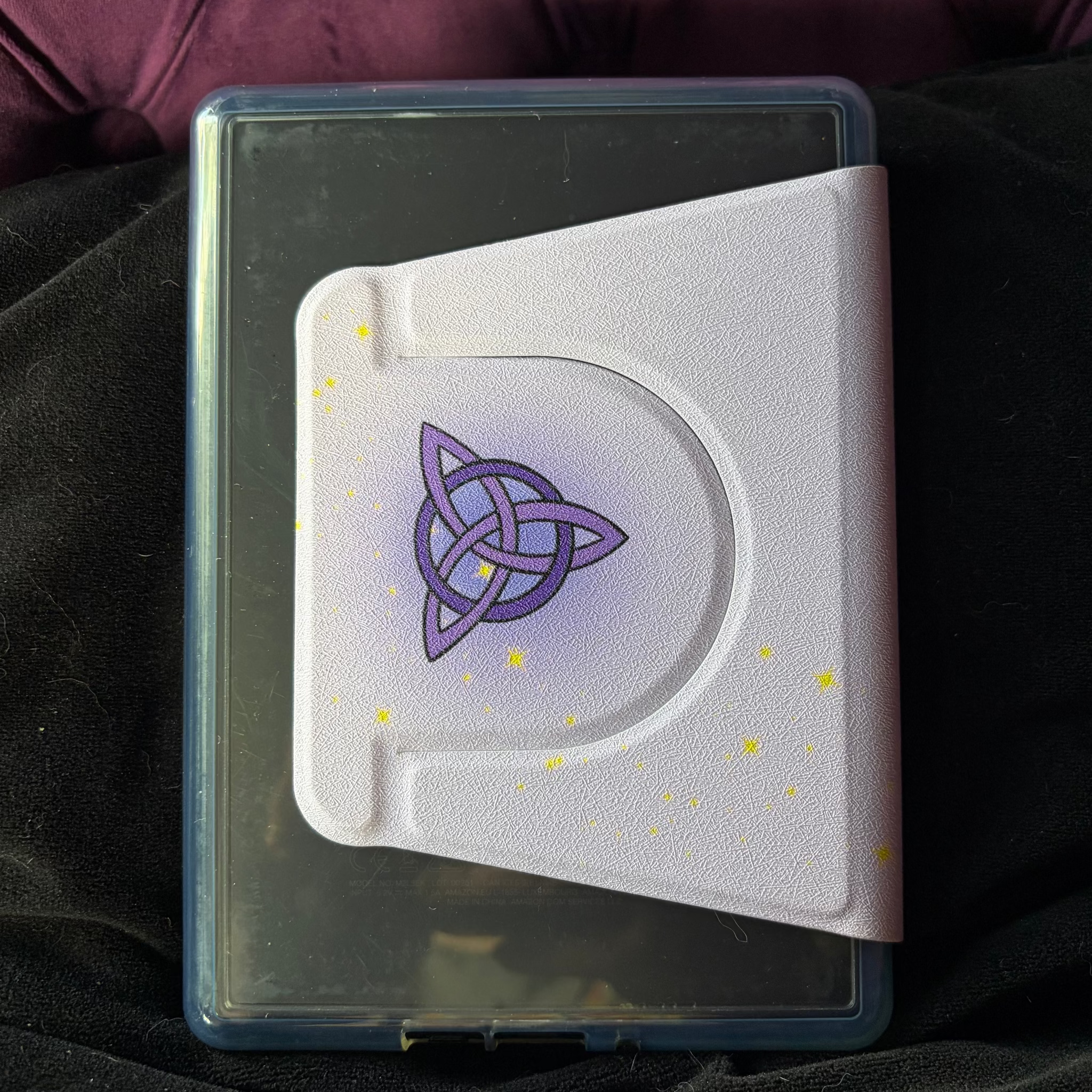 Kindle Hard Flip Case - Celtic Dreamer. Purple Case with dreamy Snow capped mountains and a celestial backdrop. A magical Celtic doorway appears from an open book.&nbsp;  3 in 1 Flip case for Kindle. Features auto wake/sleep function  detachable
