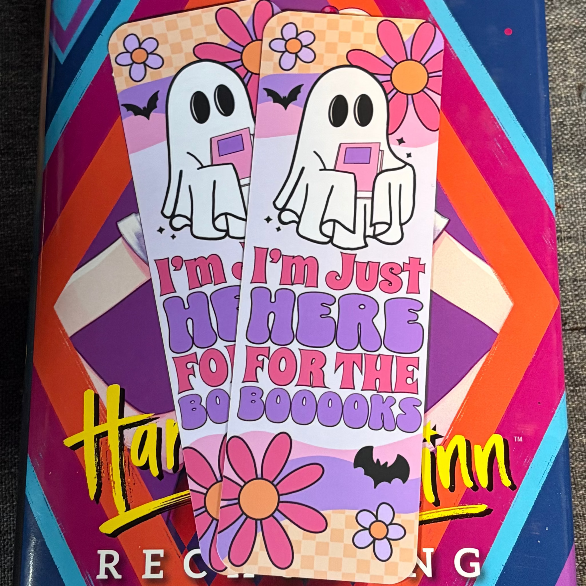 Pastel ghost bookmark with an open book, flowers, bats and I’m Just Here for the Boooooks lettering
