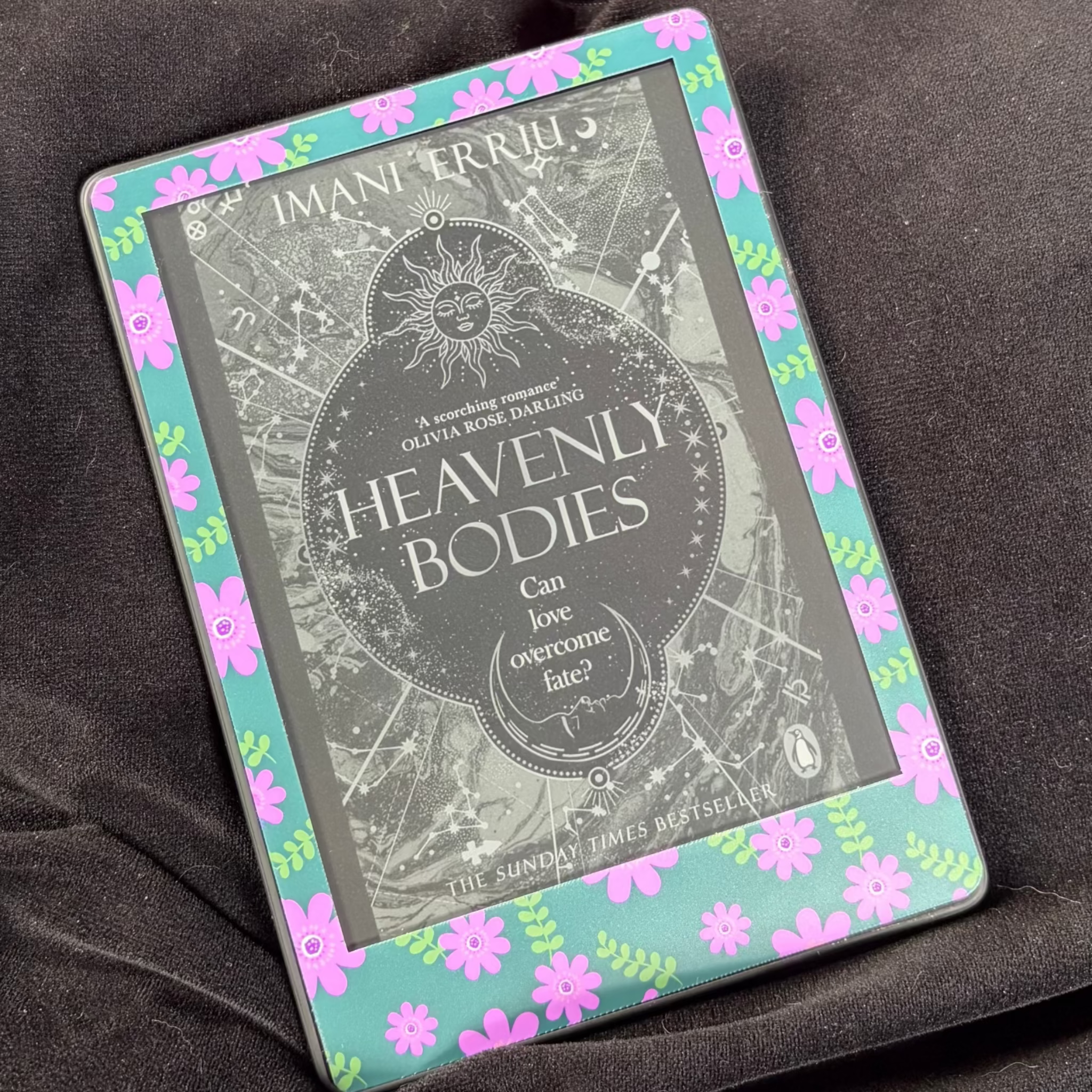 Pink Daisy Meadow removable front Kindle skin with pink flowers and green leaves on a turquoise background
