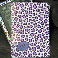 White Kindle backing insert with black and purple leopard print, blue-purple lips and a multicoloured glitter finish
