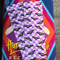 Purple checkerboard bookmark patterned with cute black bats with large white eyes
