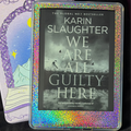Rainbow holographic vinyl skin applied to the front border surrounding a Kindle screen
