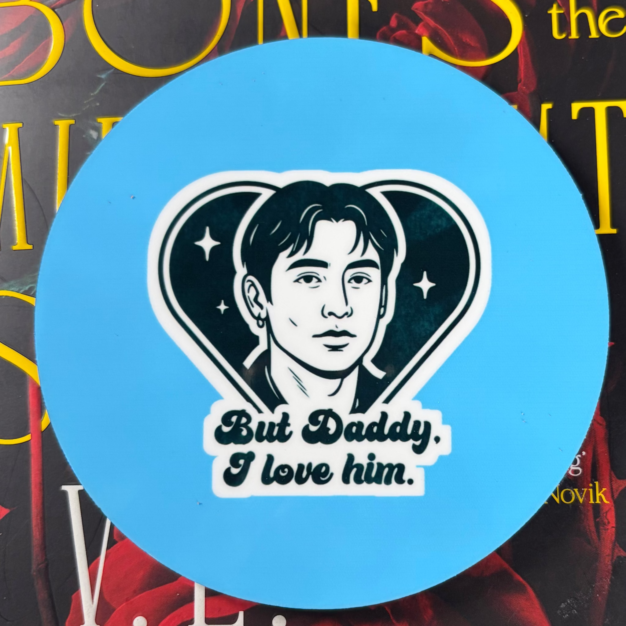 Round blue Heated Rivalry inspired coaster featuring Shane Hollander and But Daddy I Love Him lettering
