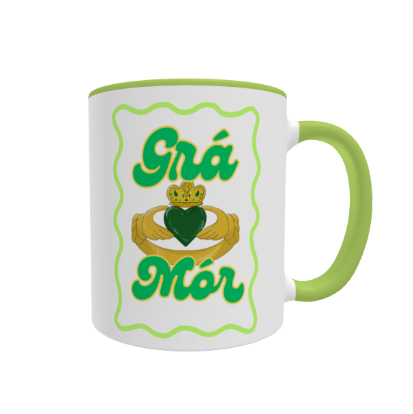 Grá Mór Claddagh Mug by Fairly Quare Designs: a colourful Claddagh with the words Grá Mór, meaning big love in Irish, on an 11oz white ceramic mug with a green handle