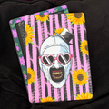 Sunflower Art the Clown, Kindle Backing Insert. Pink and black striped backround. Art the clown, horror, slasher character. Hat and heart sunglasses.&nbsp;

Made to order. Made to fit your specific model. Matte laminated for durability. Easy to install in a clear case.&nbsp;