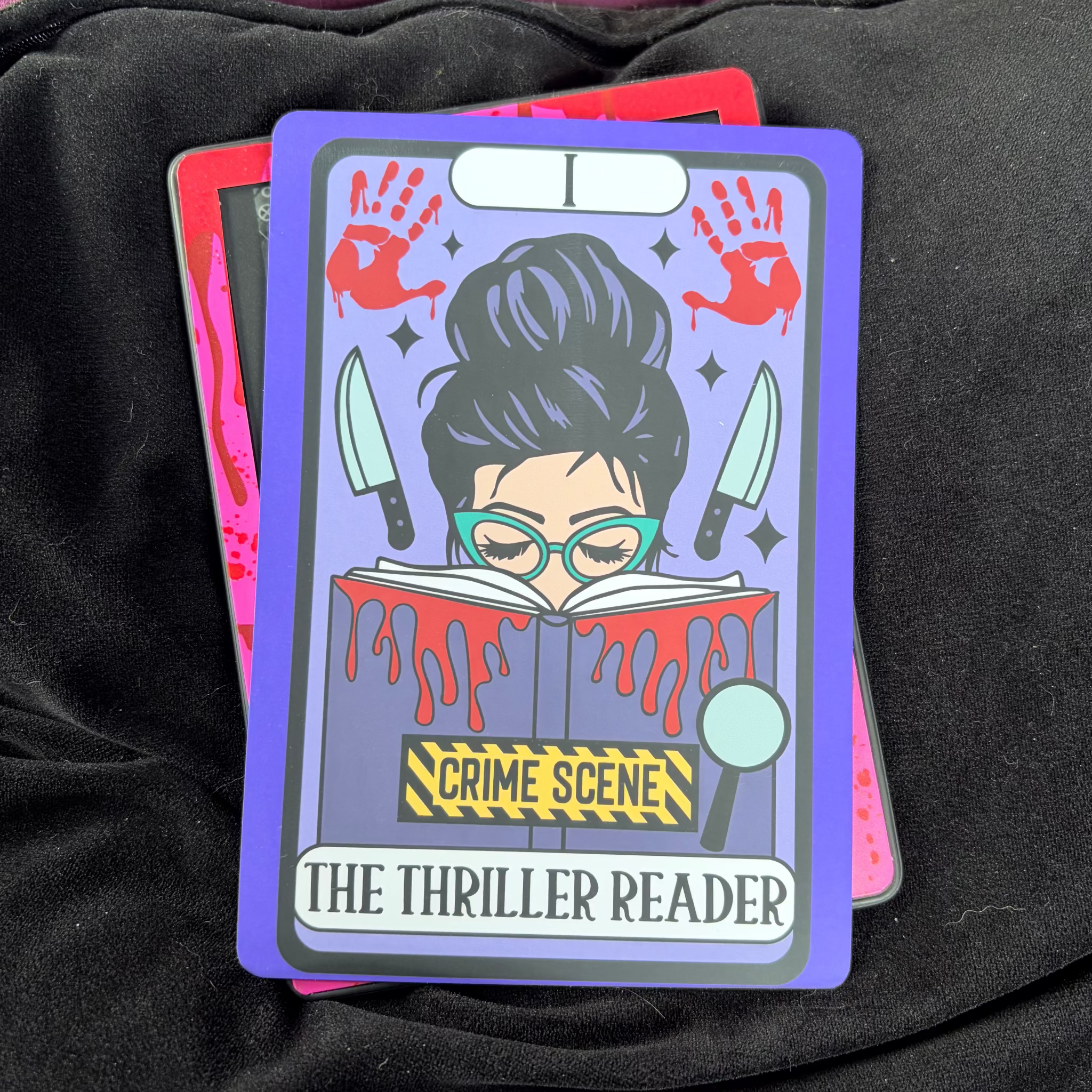 Thriller Reader, Kindle Backing Insert. Crime scene tape, bookish, slasher, bloody handprint

Made to order. Made to fit your specific model. Matte laminated for durability. Easy to install in a clear case.&nbsp;